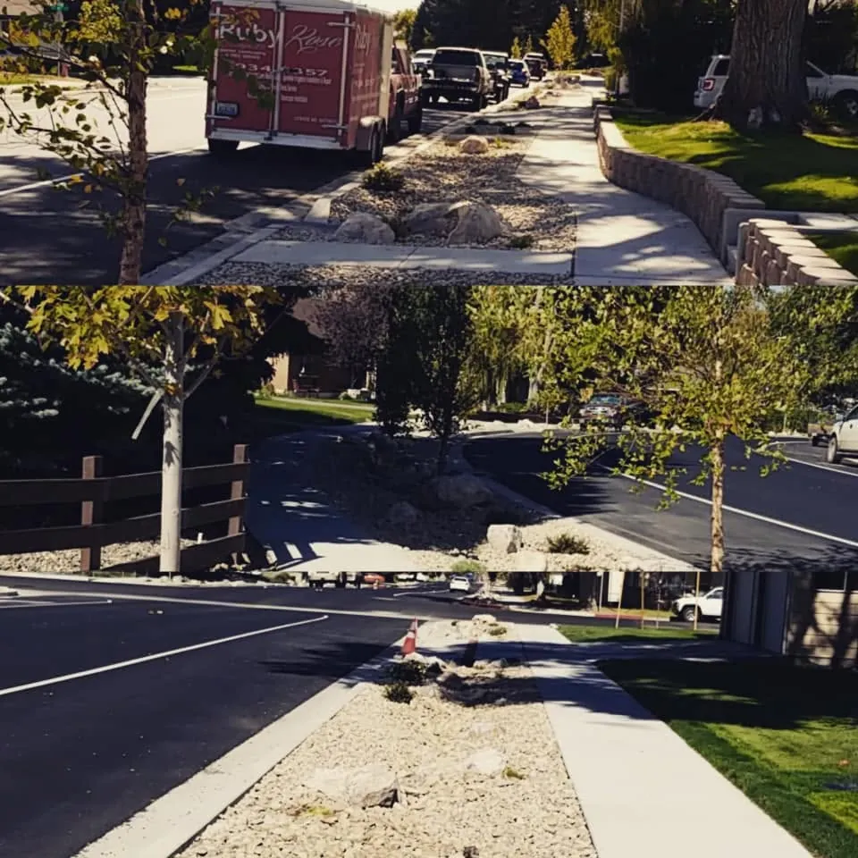 Streetside parkway strips filled with crushed rock, boulders and young trees, with a Ruby Rose branded trailer parked on the street.